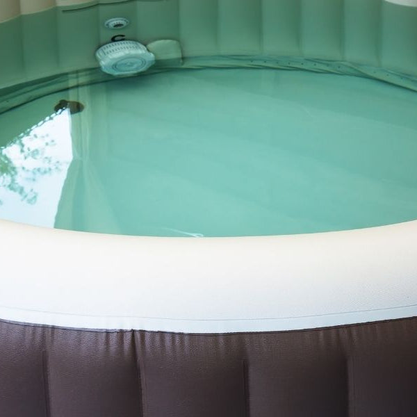 What can i put under my inflatable hot tub?